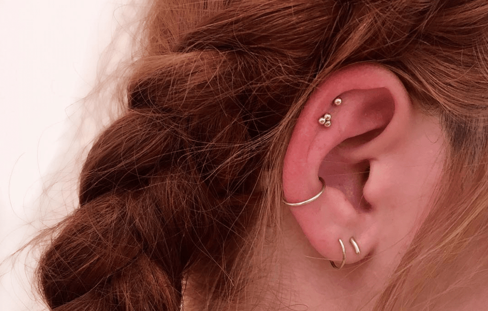 Jewelry for ear piercing and body piercing on white background